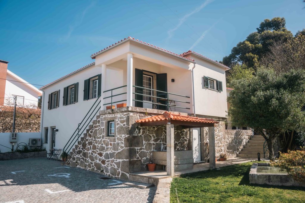 House with outdoor stone staircase