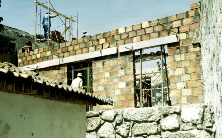 New walls going up on the old stone house