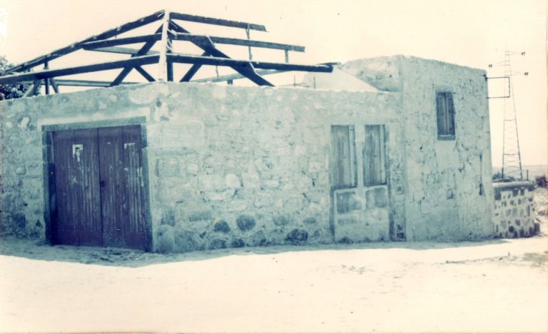 Old stone building with new roof beams