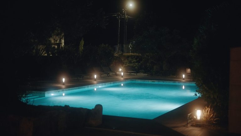 Lit pool in the evening